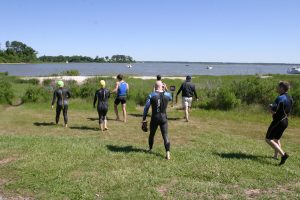 Swimmers head out to York River in 2013 Peace Frogs Bank to Bank Charity Swim